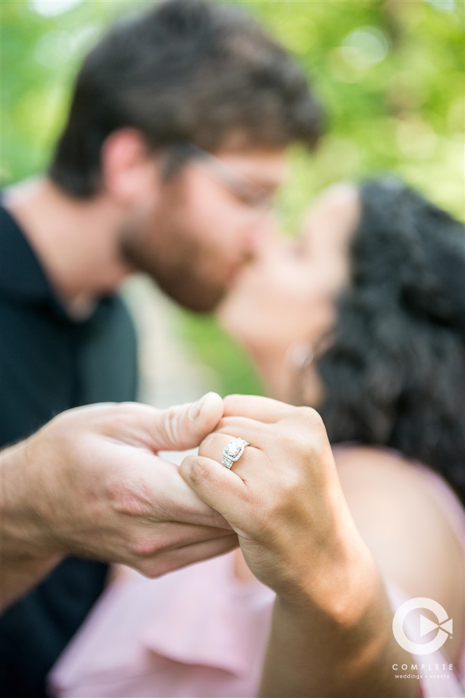 Fiance showcasing her new engagement ring in Milwaukee, WI engagement shoot