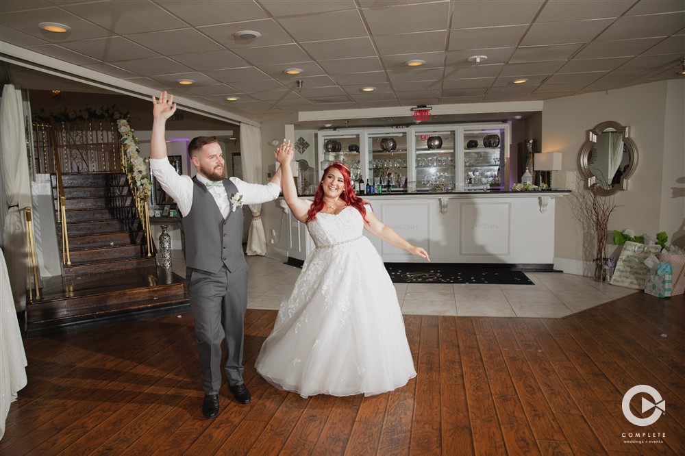 Milwaukee bride and groom entrance Picking the Perfect First Dance for Your Wedding?