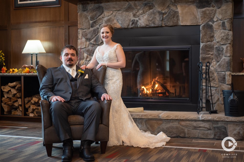 Milwaukee wedding photo near fireplace of 2020 wedding couple
