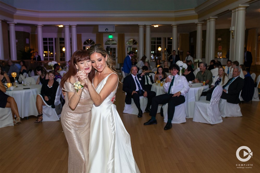 bride and mother dancing at reception