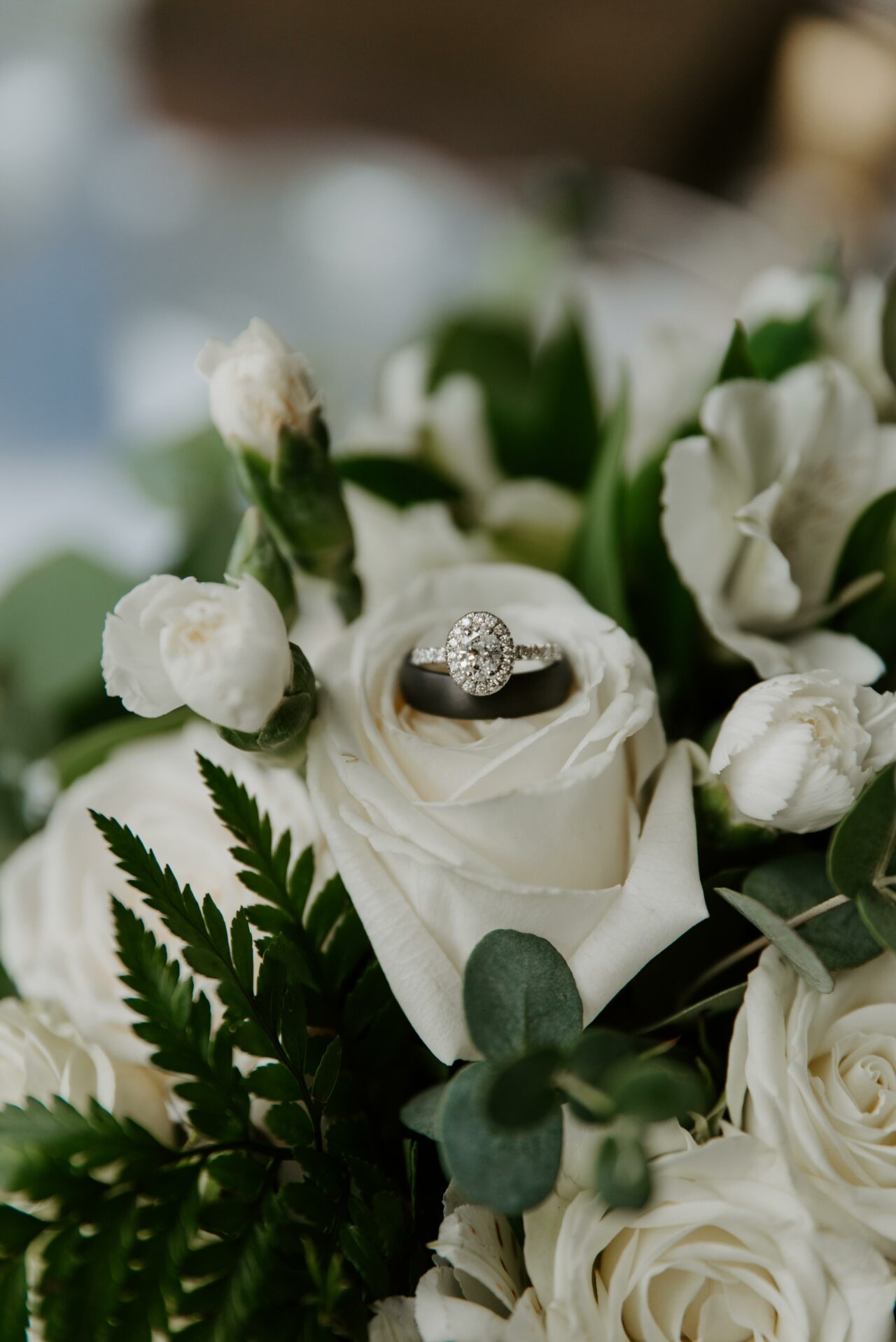 White flowers, wedding rings