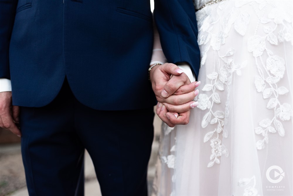 Bride and Groom Holding Hands