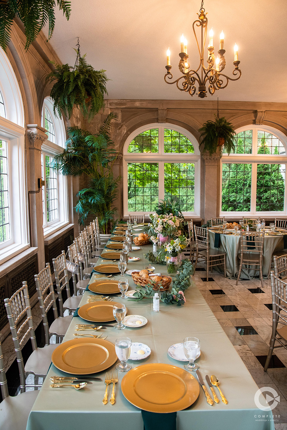 reception decor in sage and gold wedding colors