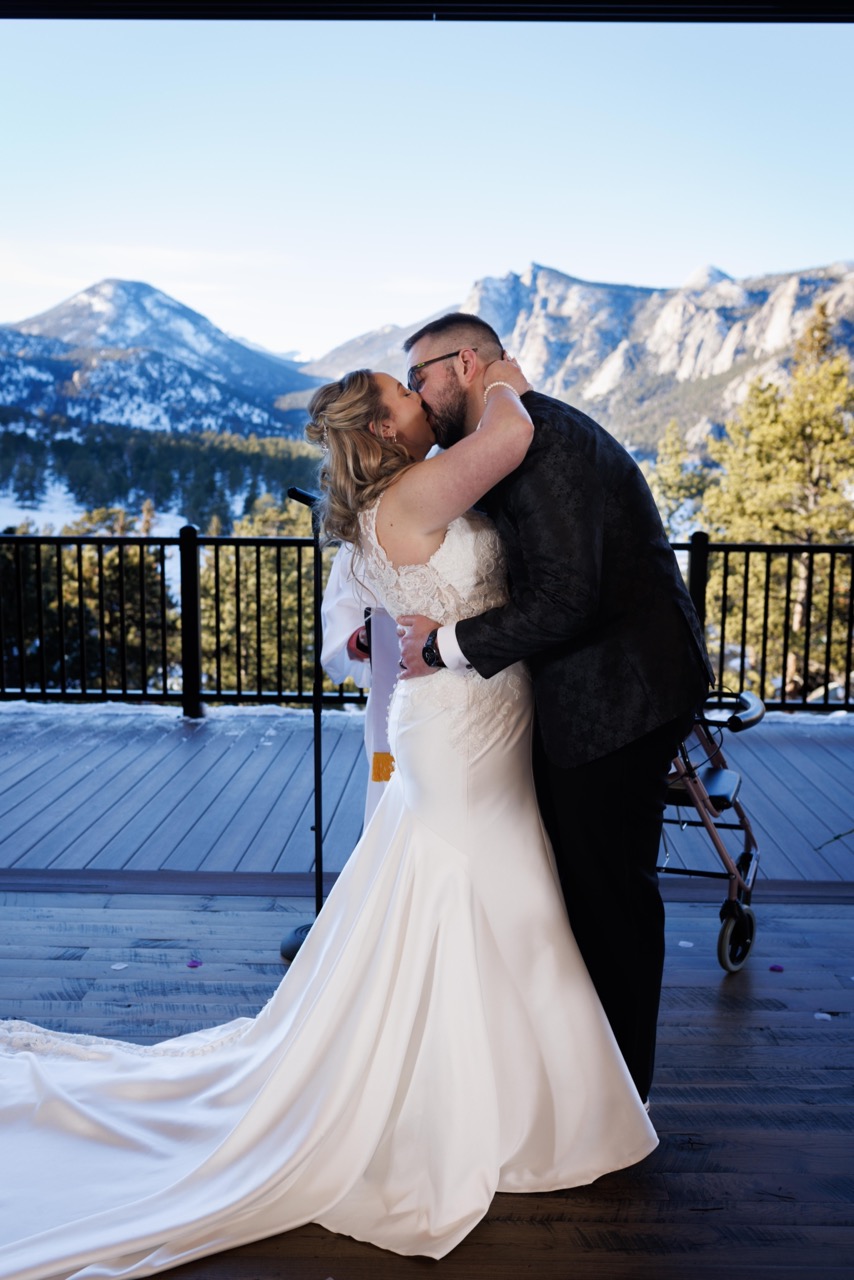 bride and groom kiss during ceremony