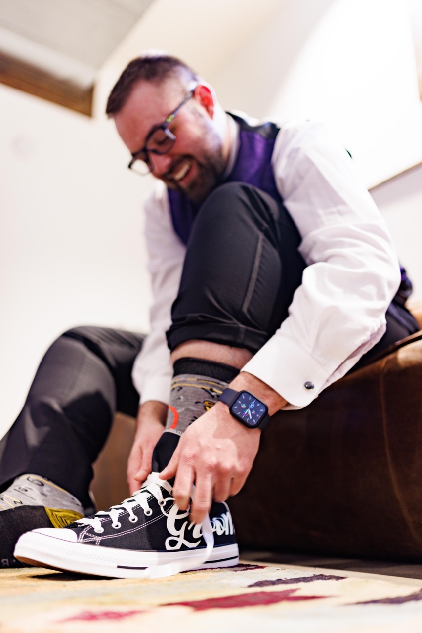 groom putting on shoes