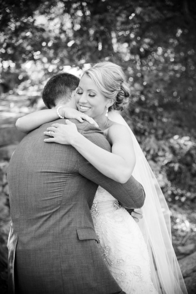 candid moment between bride and groom after first look | Top of the Rock Wedding