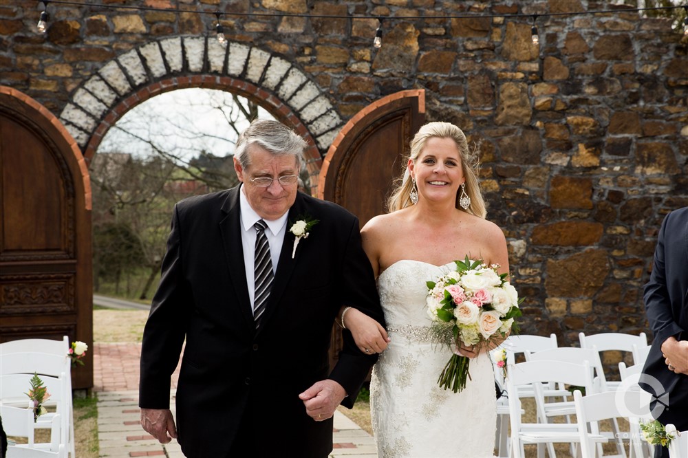 Father escorting bride down the aisle at Sassafras Springs Wedding Venue