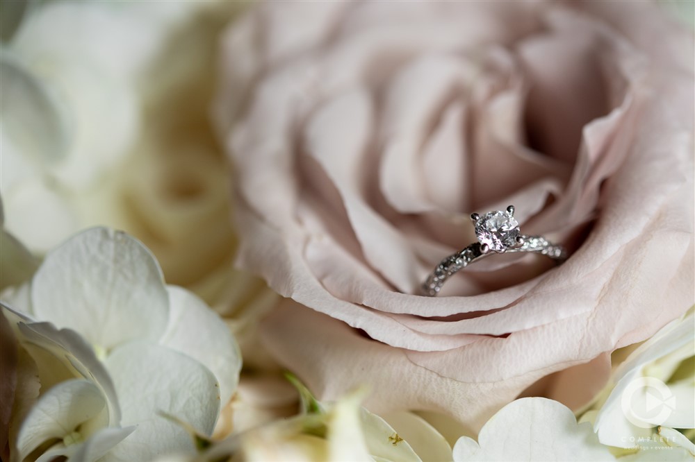 wedding ring tucked into bouquet