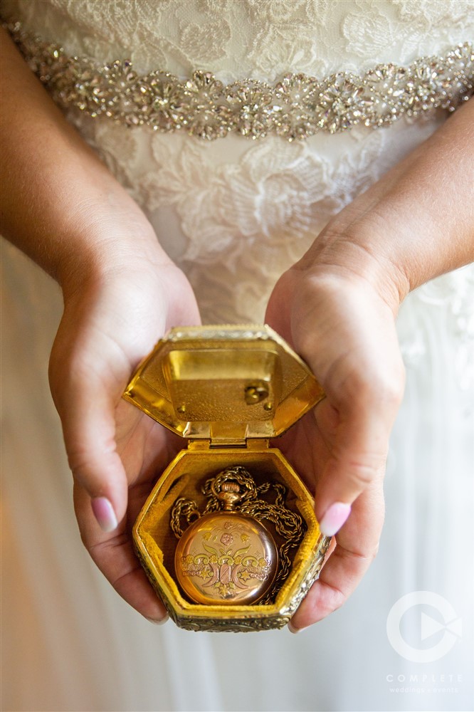 Bride holding box containing ceremonial pocket watch | Northwest Arkansas Wedding Photography