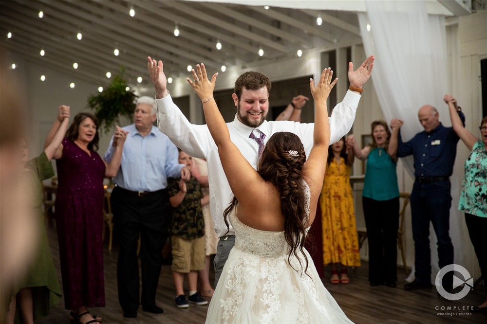 Northwest Arkansas Wedding Photography with Bride and Groom dancing to Shout