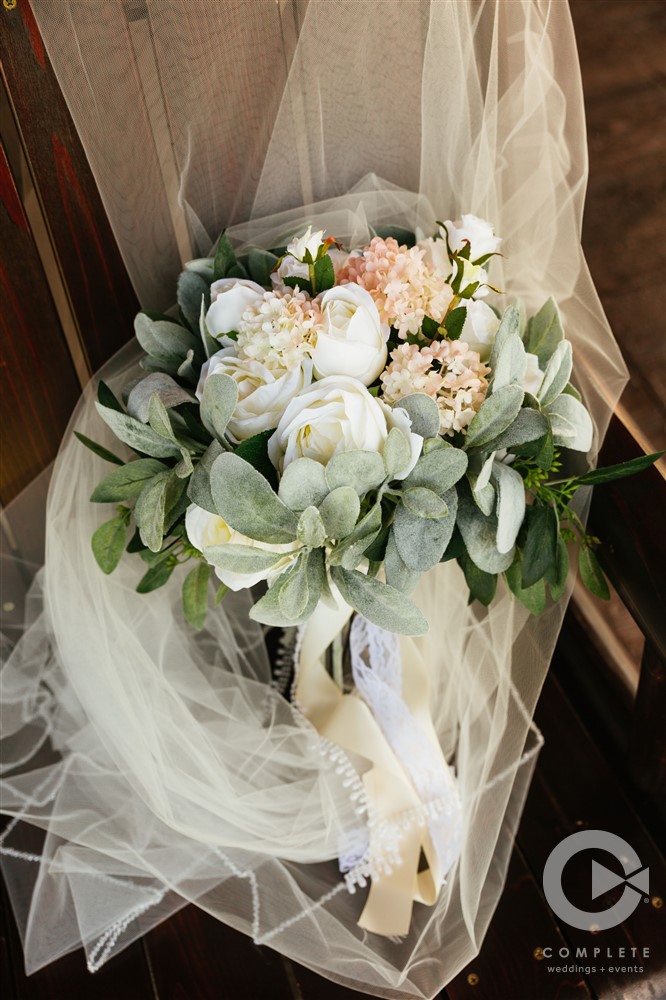 focus shot of white rose bridal bouquet