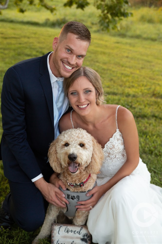 portrait of bride, groom, and their dog