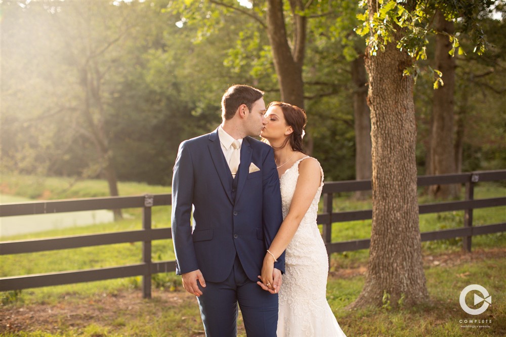 Bride and Groom Kissing at Barn at the Springs