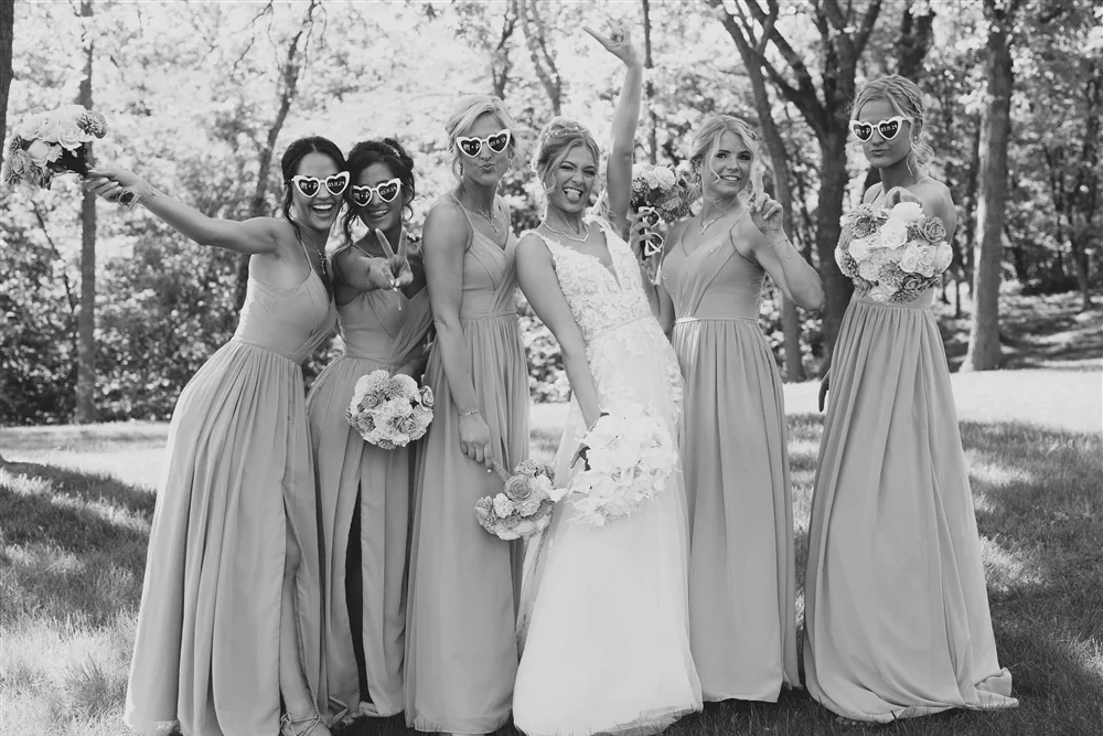 Bride and girls at Castle Unicorn a venue outside of Omaha with wedding photographer Trevor Wiltgen