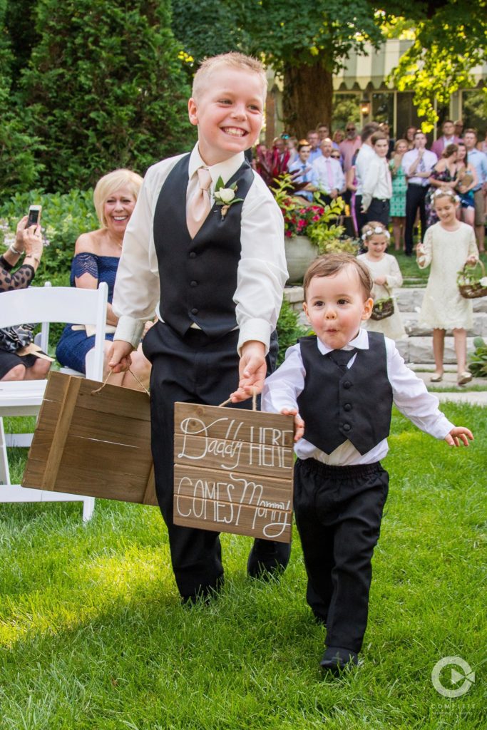 two ring bearers with signs