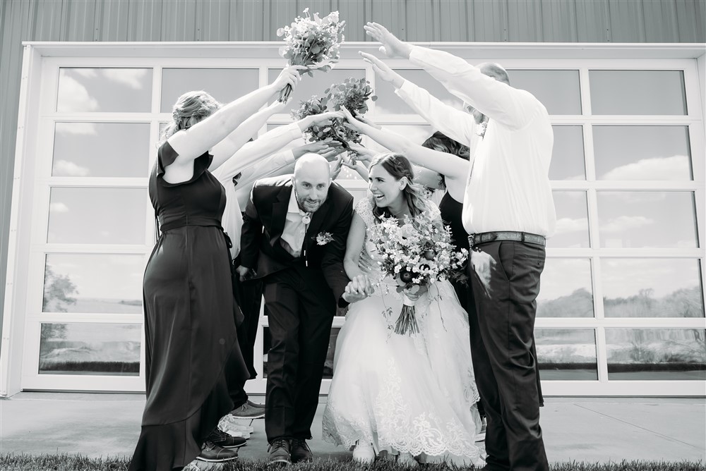 A wedding at Spark Barn a venue located right outside of Omaha, NE going under bridal party with wedding photographer Erin Mitchell