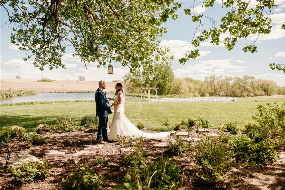 A wedding at Spark Barn a venue located right outside of Omaha, NE during the first look with wedding photographer Erin Mitchell