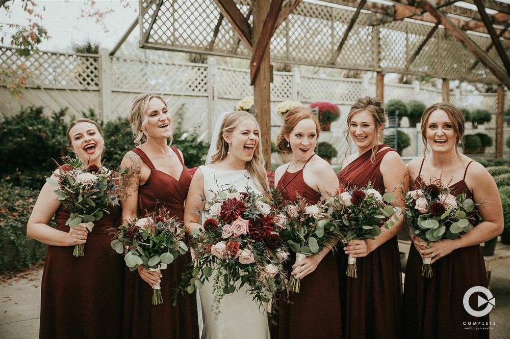bridesmaids in maroon with bride