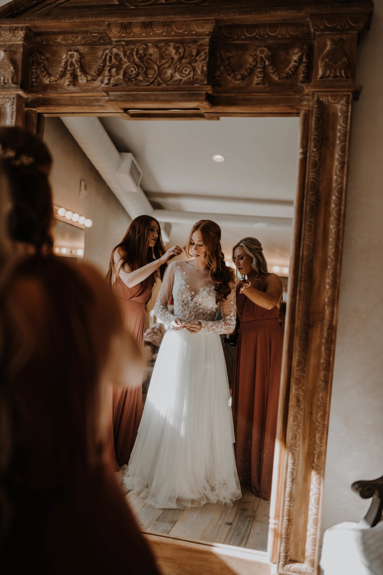 bride in front of mirror