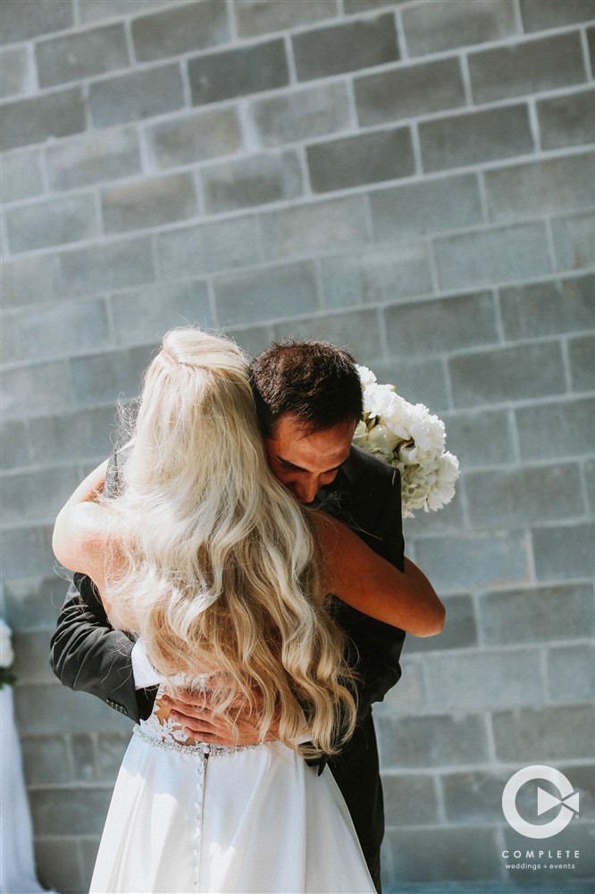 bride and groom hug