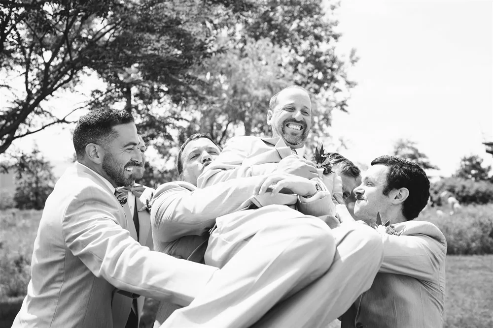 Groom being lifted