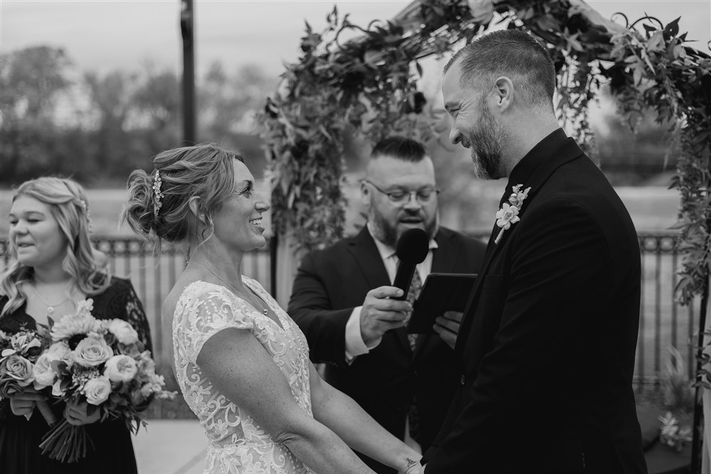 Bride and groom at the alter Beardmore Event Center in Omaha, NE with photographer Ade Idowu