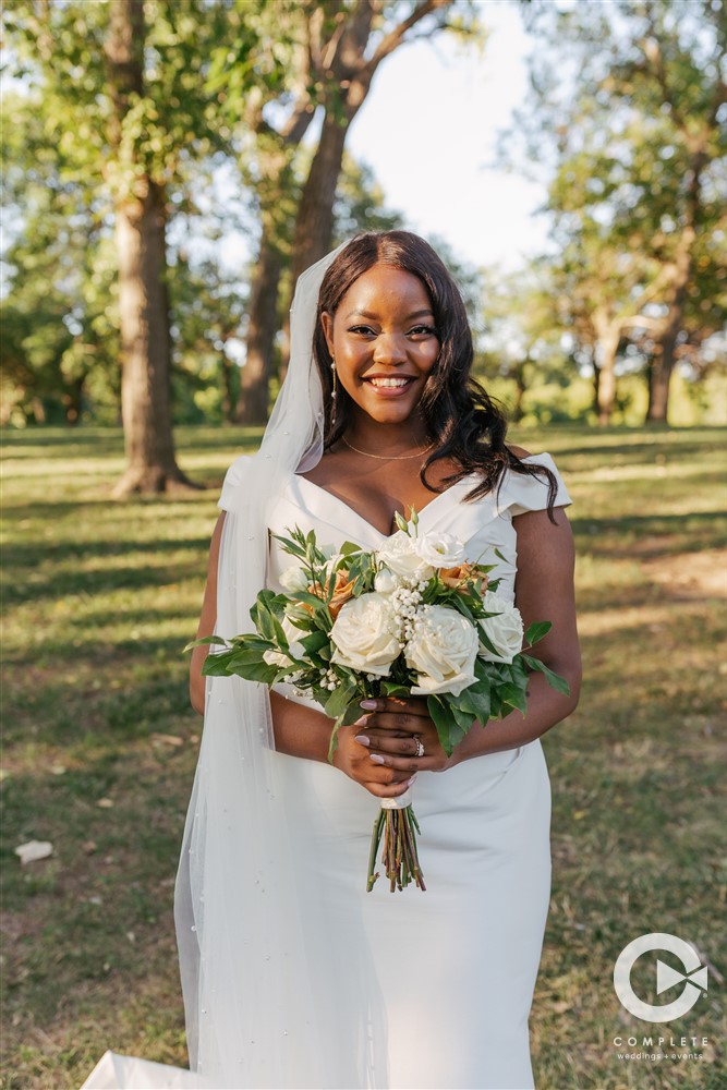 bride's simple dress and floral bouquet