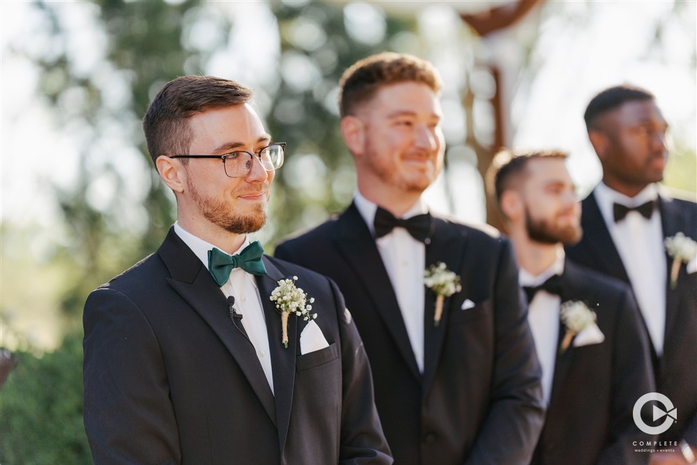 grooms reaction as bride walks down the aisle
