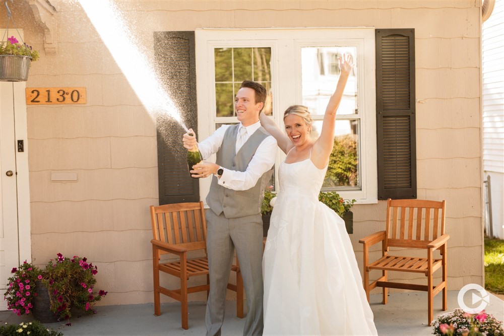 Newlyweds Popping champagne