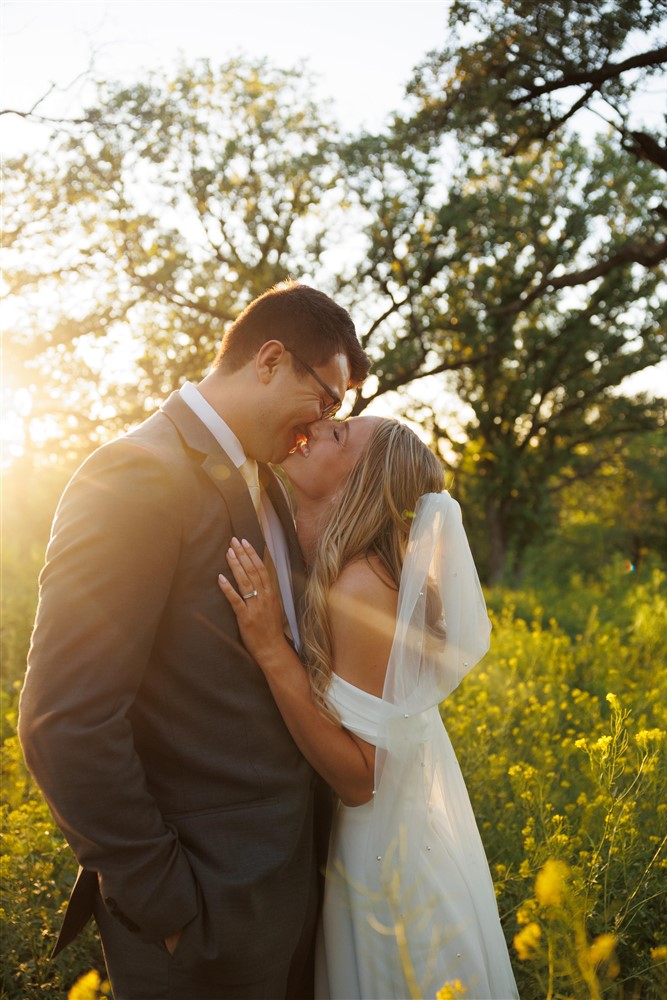 Giving kisses during sunet at Mahoney state park with wedding photographer Eddie Lucero