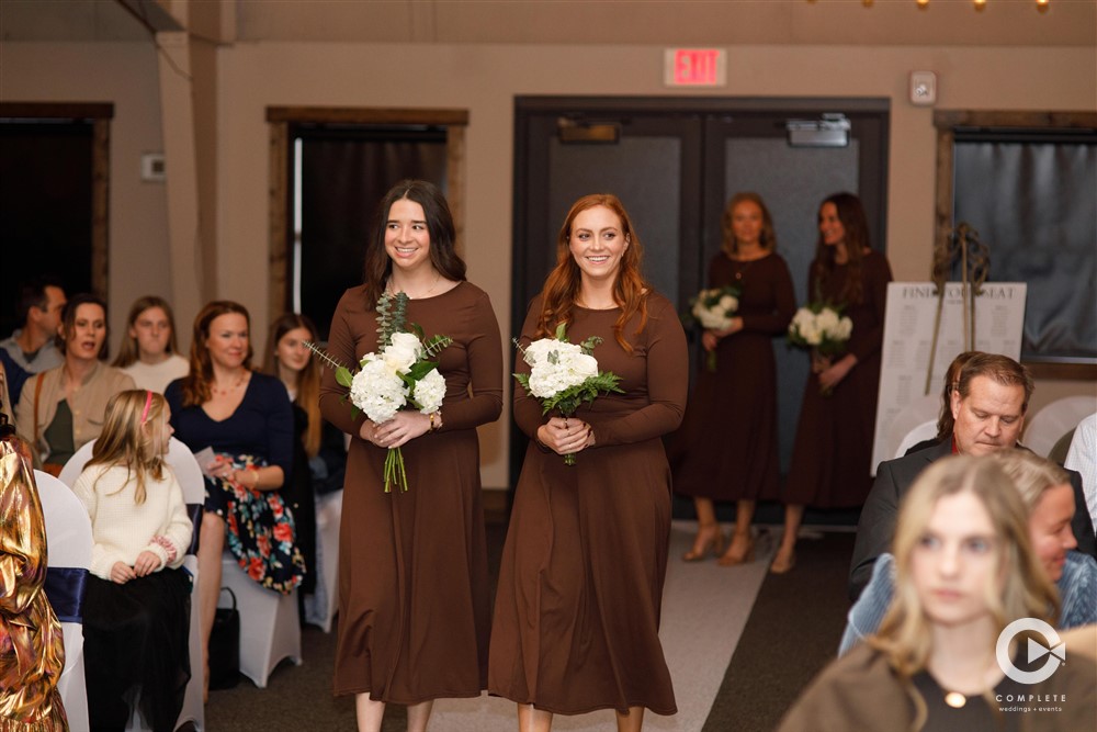 bridesmaids walking down the aisle