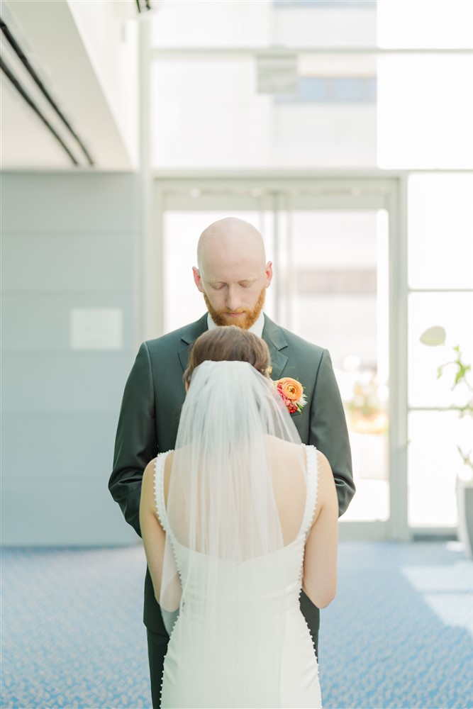 Bride and groom at the Holland Center in Omaha NE with photographer Claire Katan