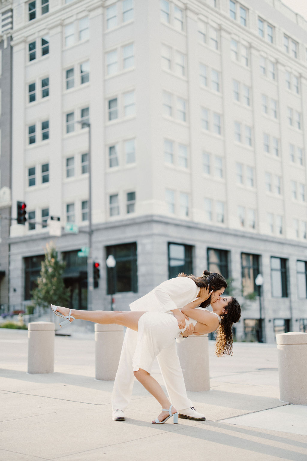 Bride and groom outside of their Downtown venue captured by Vanessa with Complete Weddings + Events Omaha wedding photographer