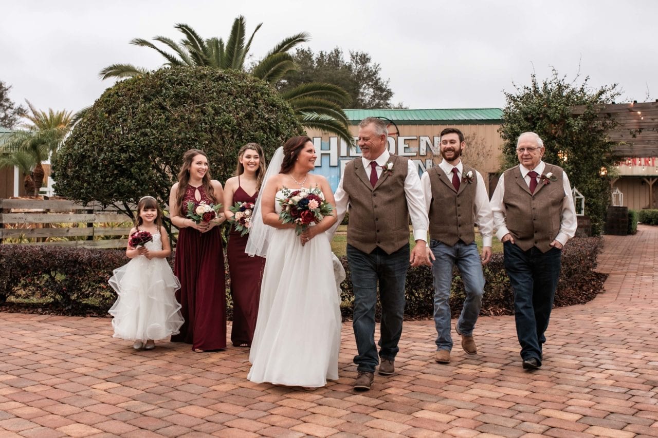 Beautiful wedding party walking at The Hidden Barn wedding venue Daniella Orlando photographer
