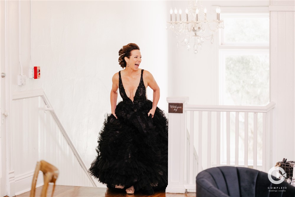 Bride walks up stairs happy at her Venue 1902 wedding reception
