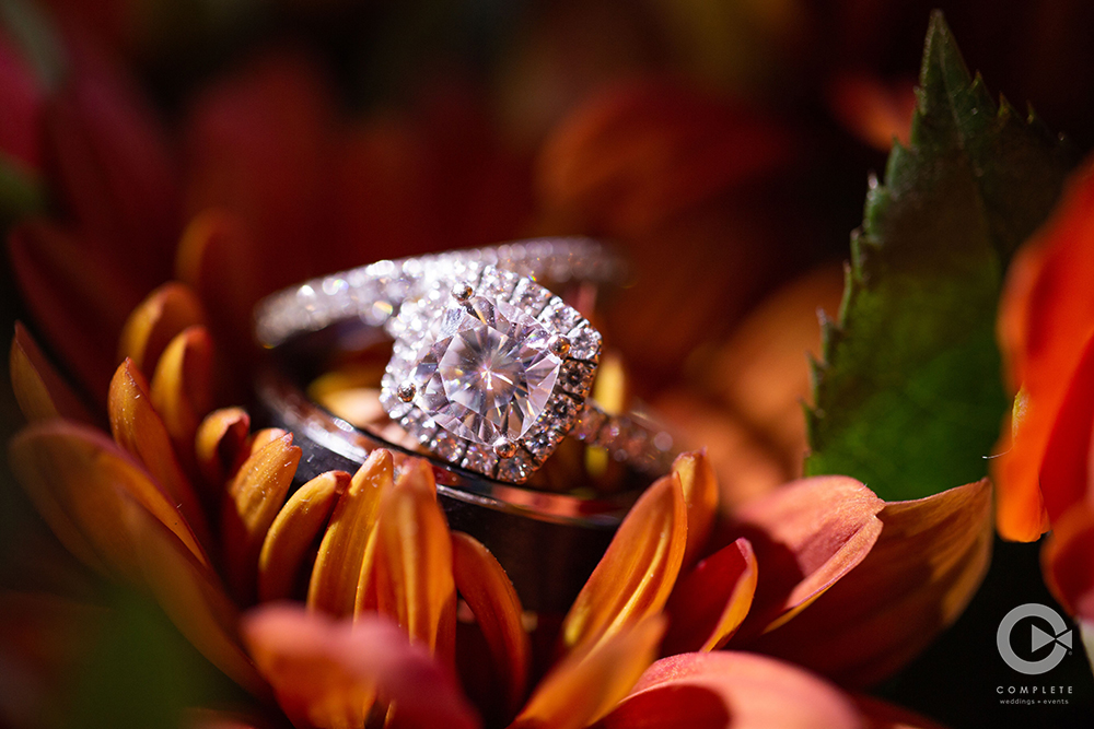 Wedding rings stacked on a flower during wedding in Orlando