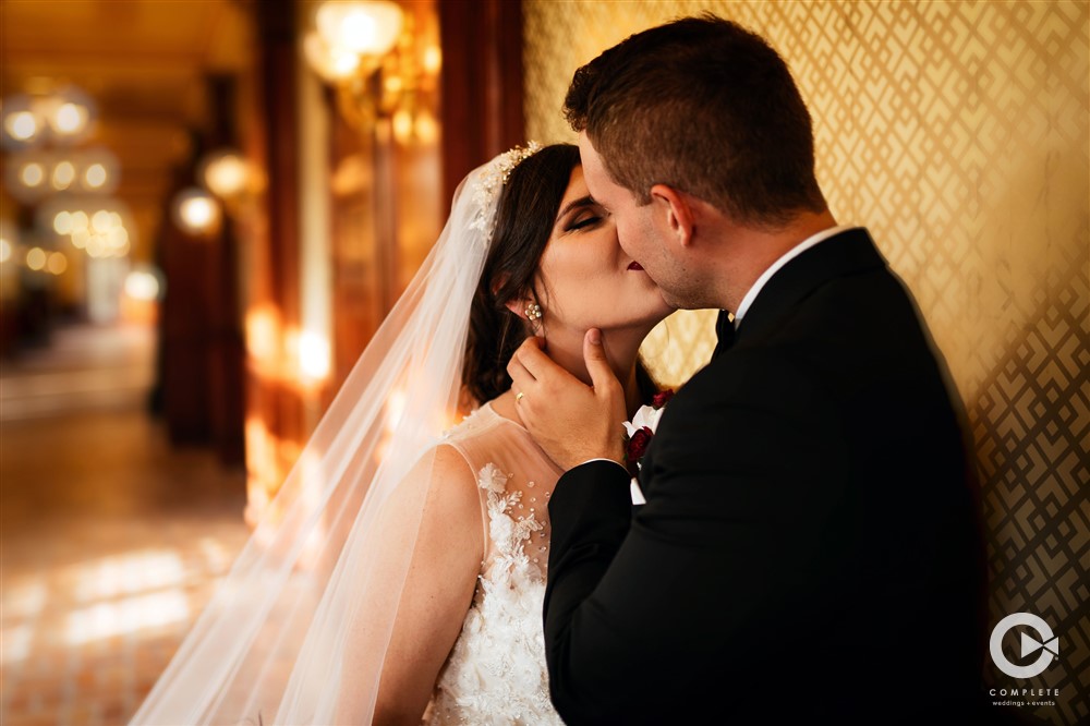 2021 wedding Features Orlando Wedding Portrait shot in downtown wedding venue bride and groom kiss