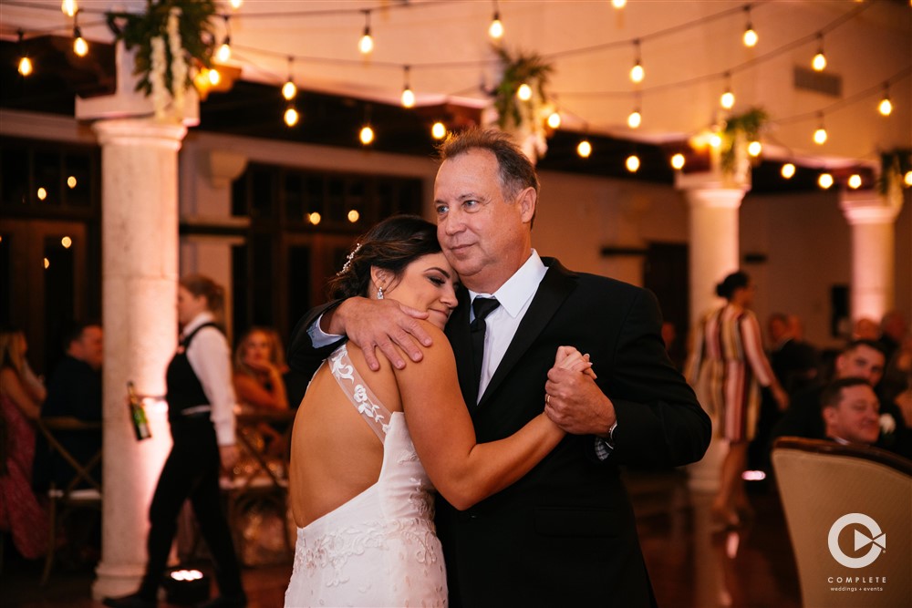 Daughter dancing with father at wedding