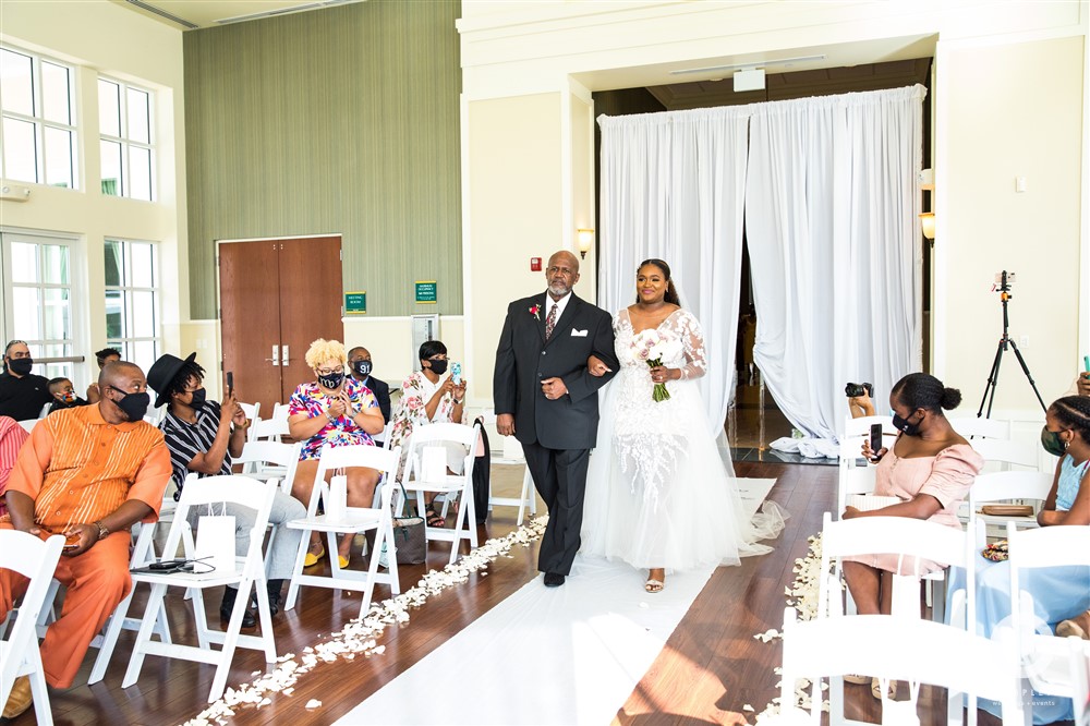 Bride being walked in by father at Lake Mary Events Center wedding photo
