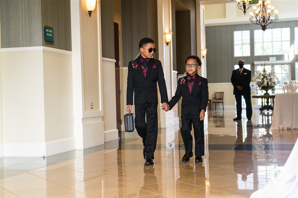 Fall wedding two ring bearers ring security at Lake Mary Events Center