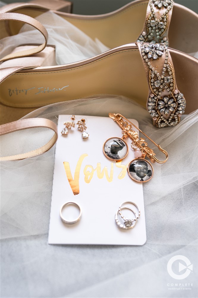 Vertical shot of vows rings and shoes in Lake Mary Florida