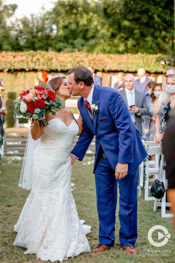 Bride and groom kissing at The Acre Orlando