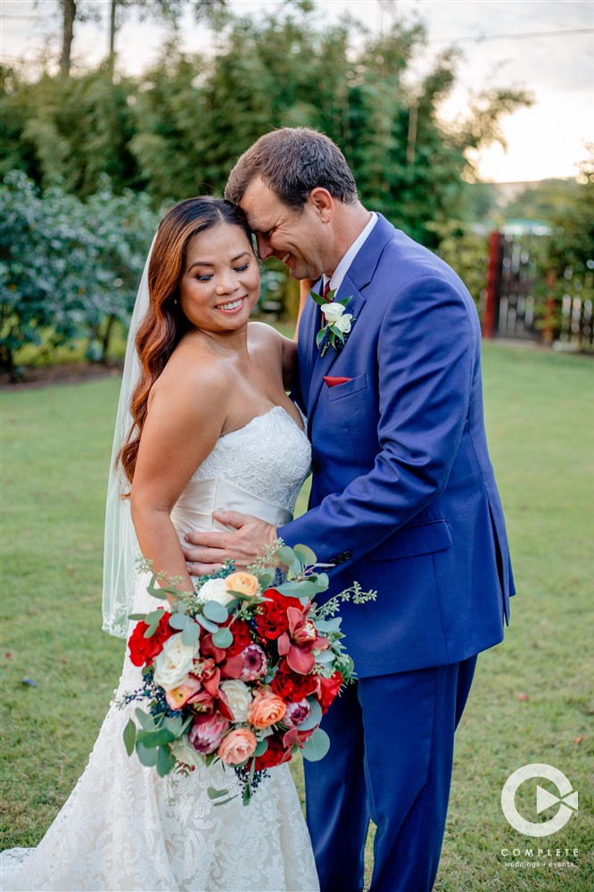 Wedding couple after ceremony at The Acre in Orlando, FL wearing bright colors