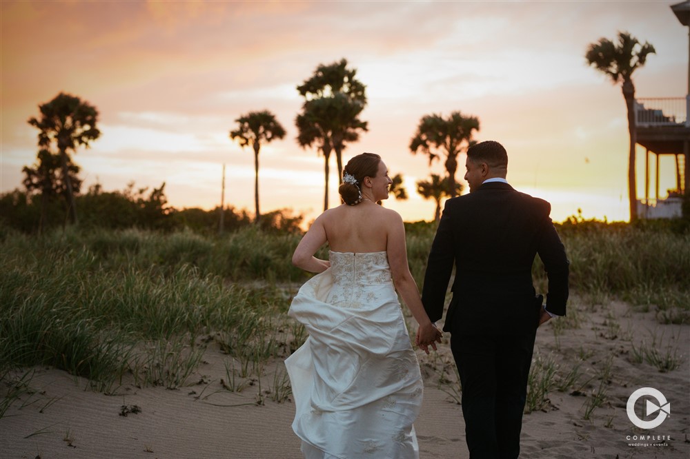 Sunset wedding photo during a Florida small beach wedding photographer