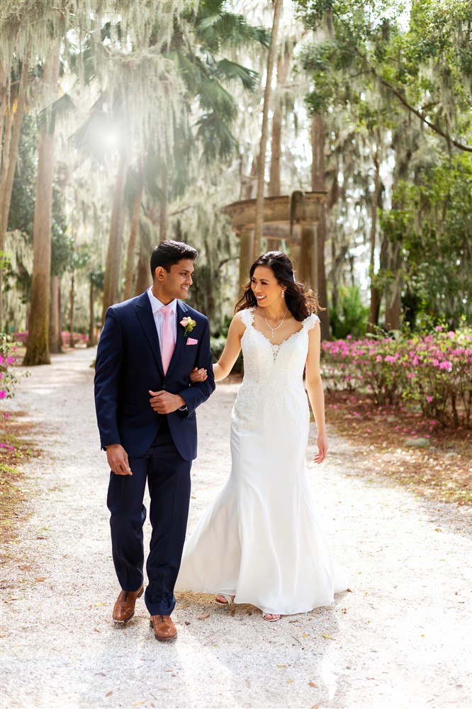 Bride and groom getting photos taken at Azaela Park in Winter Park FL