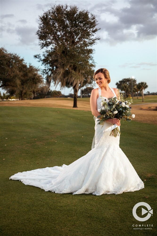 Gorgeous wedding photo of the bride during cocktail hour at her Omni Resort Orlando wedding