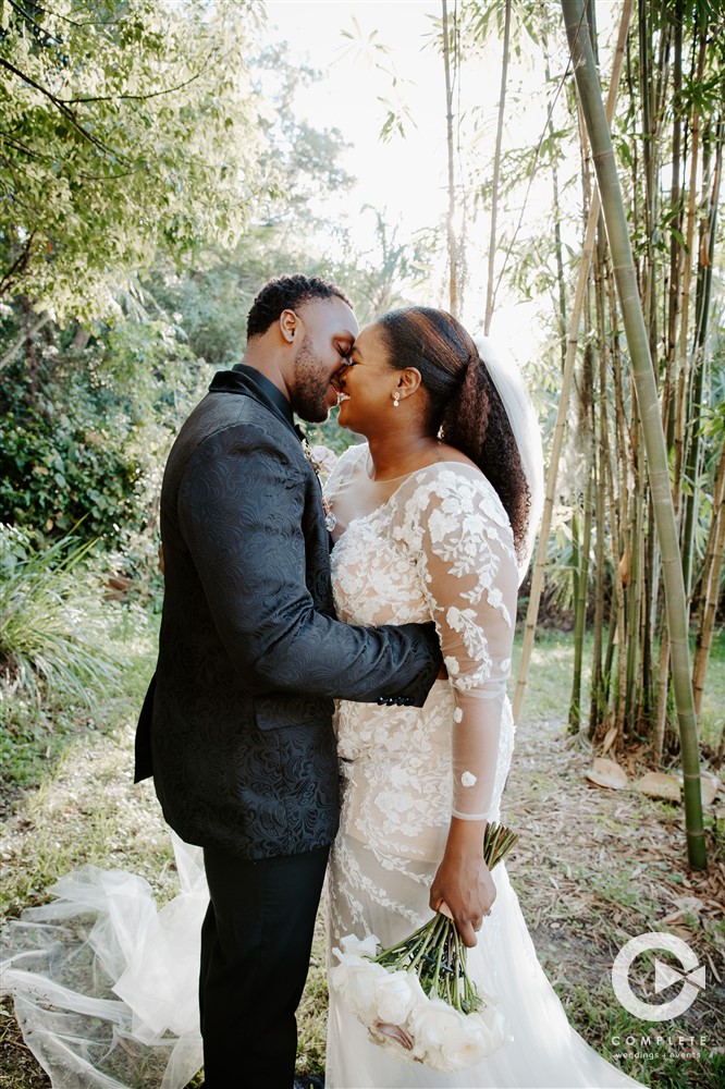 Why Have Two Wedding Photographers? Bride and groom kiss at Lake Mary Event Center wedding