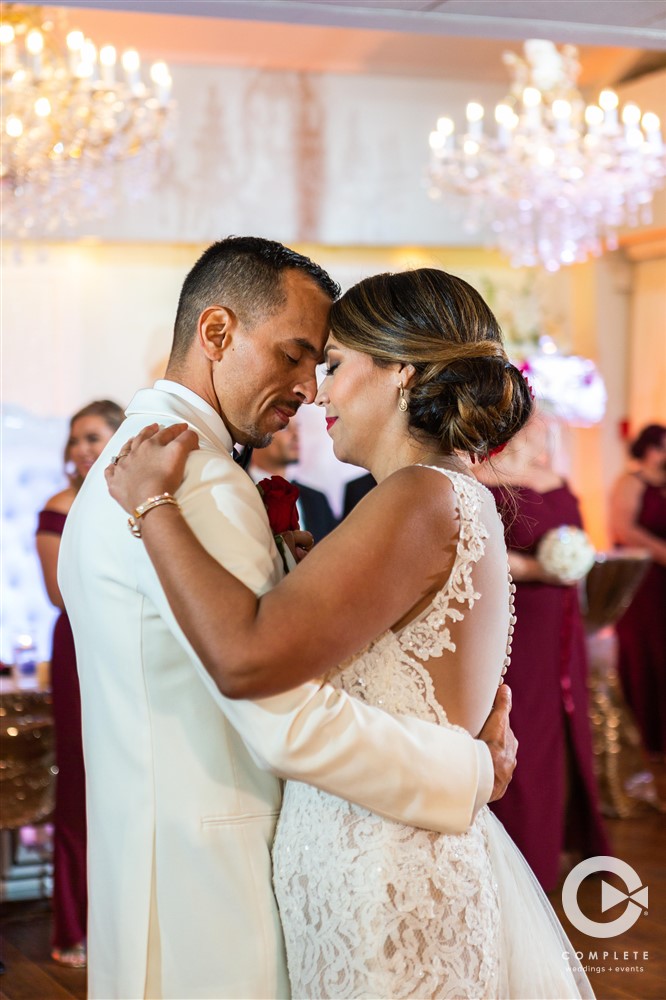 Bride and groom dancing together fun wedding moment during January wedding