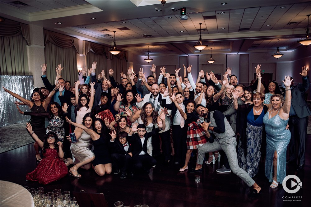 Wedding Reception Games + Entertainment Ideas! Group photo of all guests and bride and groom at Lake Mary Events Center during winter wedding