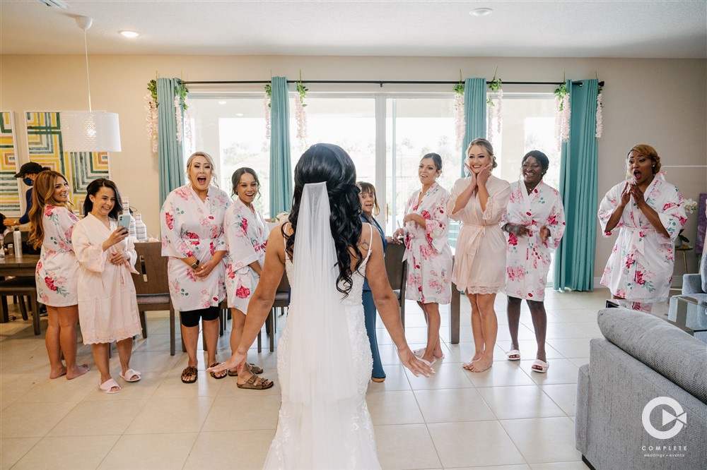 Bride reveal to her bridesmaids and family